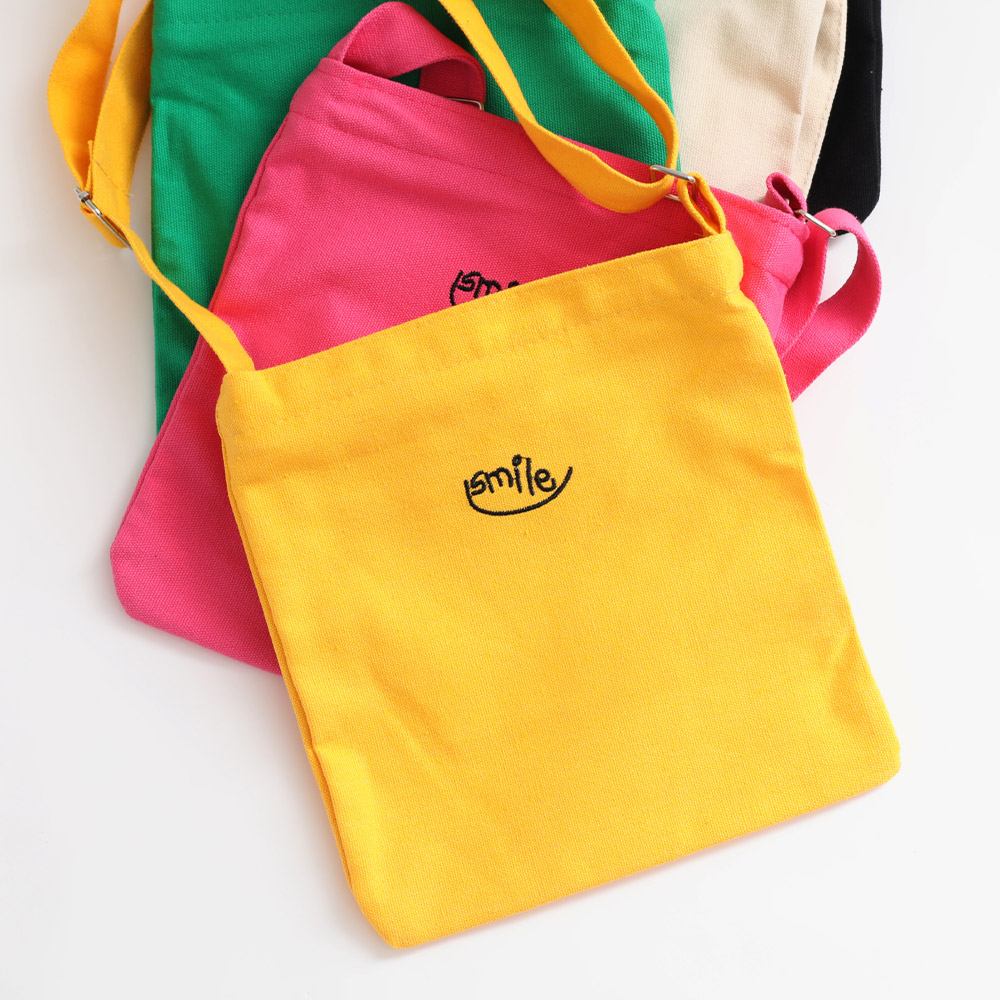 SMILE embroidered crossbody bag