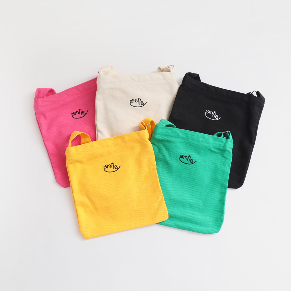 SMILE embroidered crossbody bag